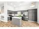 Bright kitchen features gray cabinets, stainless appliances, and a functional island at 981 Leadville Meadows Dr, Henderson, NV 89052
