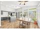 Open-concept kitchen featuring gray cabinets, stainless steel appliances, and lots of windows at 981 Leadville Meadows Dr, Henderson, NV 89052