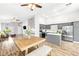 Open concept kitchen and living area with natural light and wood-style flooring at 981 Leadville Meadows Dr, Henderson, NV 89052