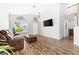 Inviting living room with wood floors, lots of natural light, and a neutral color palette at 981 Leadville Meadows Dr, Henderson, NV 89052