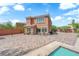 The spacious backyard has a covered seating area, pool and large patio at 9906 Stiges St, Las Vegas, NV 89178