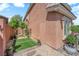 Backyard view features neutral colored wall and patio with small patch of grass at 9906 Stiges St, Las Vegas, NV 89178