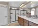 Modern bathroom features a double sink vanity and a large glass shower at 9906 Stiges St, Las Vegas, NV 89178