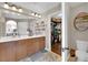 Bright bathroom boasts double sinks, ample counter space, and an adjacent walk-in closet at 9906 Stiges St, Las Vegas, NV 89178