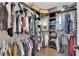 Well-organized closet with hanging racks and shelves for clothing and accessories at 9906 Stiges St, Las Vegas, NV 89178