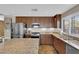 Modern kitchen with stainless steel appliances, granite countertops, custom cabinets, and a center island perfect for entertaining at 9906 Stiges St, Las Vegas, NV 89178