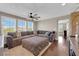 Cozy upstairs living room with plush sectional, hardwood floors, and natural light at 9906 Stiges St, Las Vegas, NV 89178