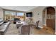 Comfortable living room featuring tile floors, a TV, and a bar area with wine storage at 9906 Stiges St, Las Vegas, NV 89178