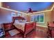 Comfortable bedroom with hardwood floors, crown molding, fan and plantation shutters at 9906 Stiges St, Las Vegas, NV 89178