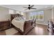 Spacious main bedroom with a ceiling fan, and a large window with backyard views at 9906 Stiges St, Las Vegas, NV 89178