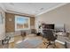 Bright office with wood floors, large window, and organized workspace at 9906 Stiges St, Las Vegas, NV 89178