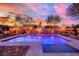 Backyard pool and spa area with mature trees and landscape lighting at 9906 Stiges St, Las Vegas, NV 89178