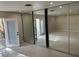 Bright bedroom featuring mirrored closet doors and an adjacent courtyard at 1006 Bel Air Cir, Las Vegas, NV 89109