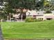 Lush landscaping in the community, featuring mature trees and green grass at 1006 Bel Air Cir, Las Vegas, NV 89109