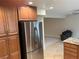 Open kitchen with stainless steel appliances and granite counters flowing into living area at 1006 Bel Air Cir, Las Vegas, NV 89109