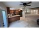 Open kitchen with wood cabinets, granite countertops, stainless steel appliances, and tile flooring at 1006 Bel Air Cir, Las Vegas, NV 89109