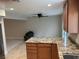 Kitchen island with granite counters and view to the open living area at 1006 Bel Air Cir, Las Vegas, NV 89109