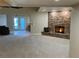 Open living room featuring a stone fireplace and outdoor access at 1006 Bel Air Cir, Las Vegas, NV 89109