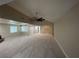 Bright and open living room with abundant natural light and a ceiling fan at 1006 Bel Air Cir, Las Vegas, NV 89109