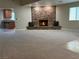 Living room with a stone fireplace and view of kitchen bar at 1006 Bel Air Cir, Las Vegas, NV 89109