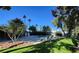 Lushly landscaped pool area with trees, lawn and lounge chairs; ideal for outdoor living at 1006 Bel Air Cir, Las Vegas, NV 89109