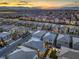 Aerial view showcases the neighborhood with city views and well-maintained streets and homes at 10140 Magnolia Creek St, Las Vegas, NV 89141