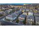 Aerial view showcasing a well-lit community with contemporary home designs and manicured landscaping at 10140 Magnolia Creek St, Las Vegas, NV 89141
