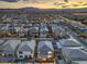 Dusk aerial view featuring a well-planned community with attractive homes and street lighting at 10140 Magnolia Creek St, Las Vegas, NV 89141