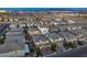 Expansive aerial view of a residential community with mountain views and city lights at 10140 Magnolia Creek St, Las Vegas, NV 89141
