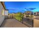 Relaxing balcony view with iron railing and a charming bistro set overlooking the community at 10140 Magnolia Creek St, Las Vegas, NV 89141