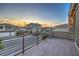 Enjoy the sunset from this spacious balcony with iron railing and community views at 10140 Magnolia Creek St, Las Vegas, NV 89141