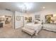 Bedroom with white furniture, bed with bench, and access to other rooms, featuring a chandelier at 10140 Magnolia Creek St, Las Vegas, NV 89141