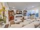 Comfortable living room with a fireplace, white sofa, and vintage decor with plenty of light at 10140 Magnolia Creek St, Las Vegas, NV 89141