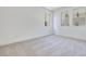 Bright bedroom with three windows and neutral carpet, providing ample natural light at 1021 Golden Summit Dr, Las Vegas, NV 89138