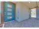 Inviting front entry with a modern blue door and decorative brick pavers at 1021 Golden Summit Dr, Las Vegas, NV 89138