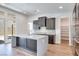 Modern kitchen features a large island, stainless steel appliances, and a walk-in pantry at 1021 Golden Summit Dr, Las Vegas, NV 89138
