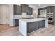 Well-equipped kitchen with island, stainless steel appliances, and dark wood cabinets at 1021 Golden Summit Dr, Las Vegas, NV 89138