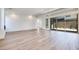 Spacious living room with beautiful light wood floors and sliding glass doors at 1021 Golden Summit Dr, Las Vegas, NV 89138