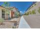 Contemporary home with desert landscaping, a brick paved path, and view of surrounding neighborhood at 1021 Golden Summit Dr, Las Vegas, NV 89138