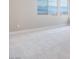 Bedroom with carpet, neutral walls, baseboard, and exterior views from windows at 10448 Smokey Mariposa, Las Vegas, NV 89166