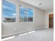 Bedroom with carpet, neutral walls, and exterior view from windows at 10448 Smokey Mariposa, Las Vegas, NV 89166