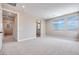 Bedroom with neutral walls, carpet, and ensuite bathroom at 10448 Smokey Mariposa, Las Vegas, NV 89166