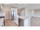 Contemporary kitchen with white cabinets, a center island, and stainless steel appliances at 10448 Smokey Mariposa, Las Vegas, NV 89166