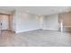 Bright and airy living room featuring neutral walls and wood-look floors at 10448 Smokey Mariposa, Las Vegas, NV 89166