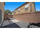 Private backyard featuring a modern patio with relaxing lounge chairs and a built-in hot tub at 106 Basketflower Ct, Las Vegas, NV 89183