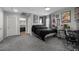 This bedroom features a large bed, a gamer station, and convenient access to an ensuite bath at 106 Basketflower Ct, Las Vegas, NV 89183