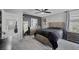 This main bedroom features a ceiling fan, mirrored dresser, and a comfortable king-sized bed at 106 Basketflower Ct, Las Vegas, NV 89183