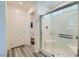 Clean bathroom featuring a glass-enclosed shower and a separate toilet area at 10650 Sariah Skye Ave, Las Vegas, NV 89166