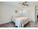 Charming bedroom with a ceiling fan, soft carpet, and a cozy bed at 10650 Sariah Skye Ave, Las Vegas, NV 89166