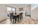 Cozy dining area with a table, seating for six, and sliding glass doors to the outside at 10650 Sariah Skye Ave, Las Vegas, NV 89166